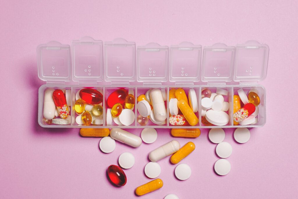 small medicine cabinet in house contains medicines and vitamin in same partition